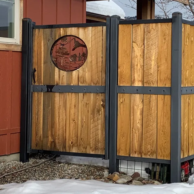 Custom wood privacy gate with painted ranch-style metal trim and hardware